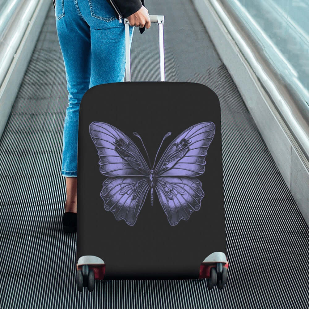 ALIM4U- Purple Monarch Butterfly Luggage Cover Person pulling a suitcase with a butterfly design on a conveyor belt