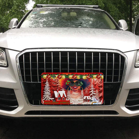 ALIM4U- Holiday Vibes Christmas Car License Plate a snow man, house sitting amongst pine trees covered with snow, a Black girl with an afro and sun glasses, on a red and white background -11.8”x5.9”
