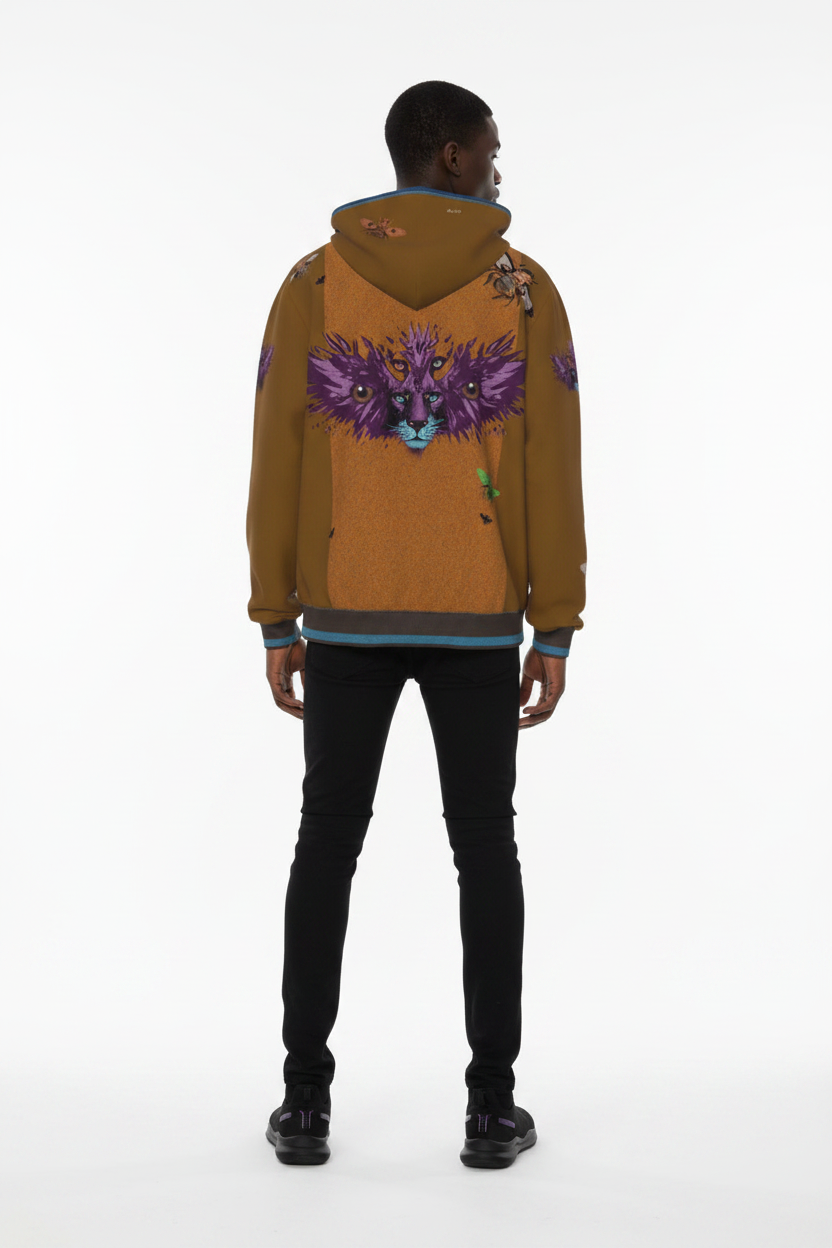 A model viewed from the back wearing a brown hooded sweatshirt with a large purple butterfly graphic on the back, paired with black pants and black shoes, against a plain white studio background.