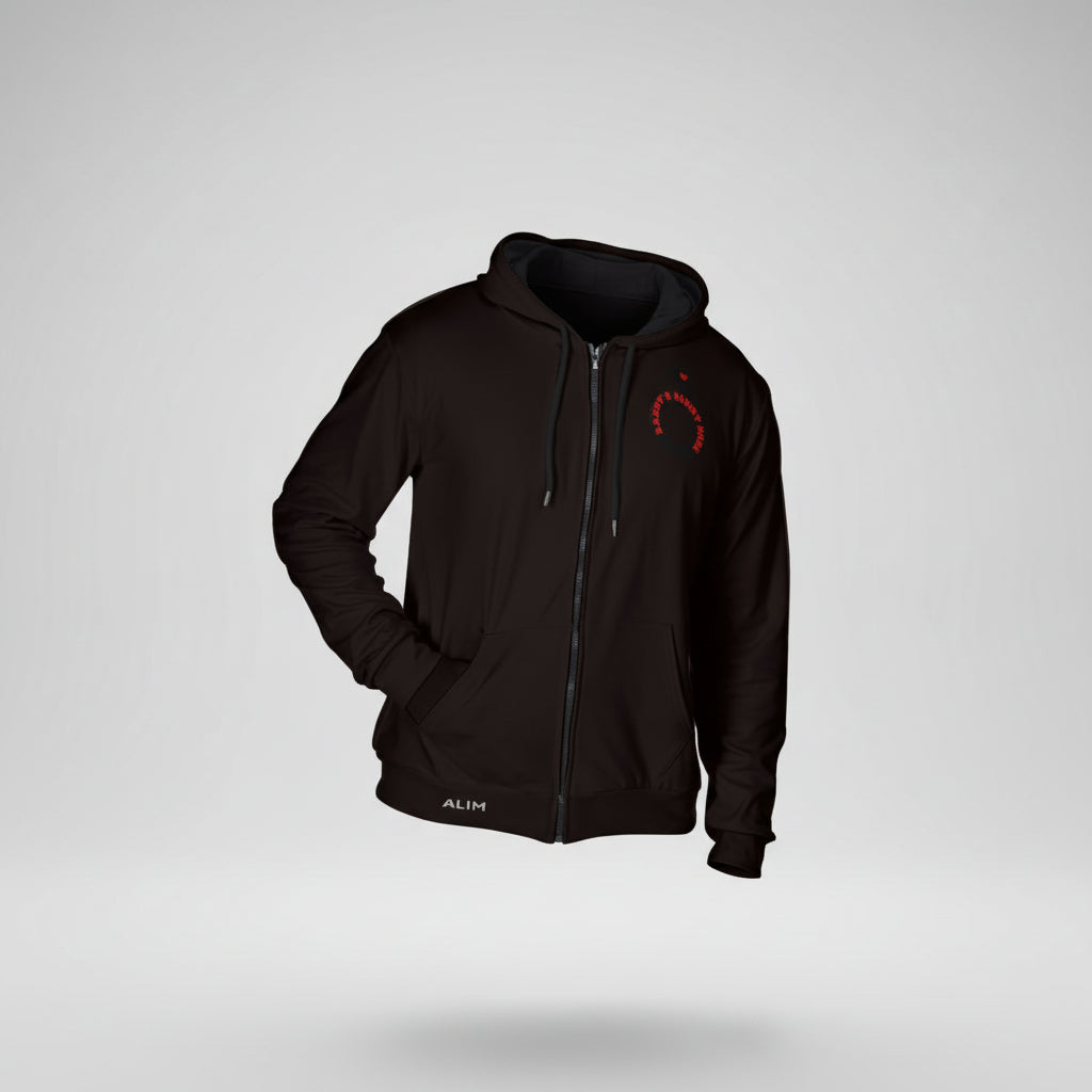 A man wearing a black zip-up hoodie with a small red logo on the left chest, shown against a white background with orange feature icons along the left side. The hoodie has a drawstring hood, kangaroo pocket, and shirled cuff.