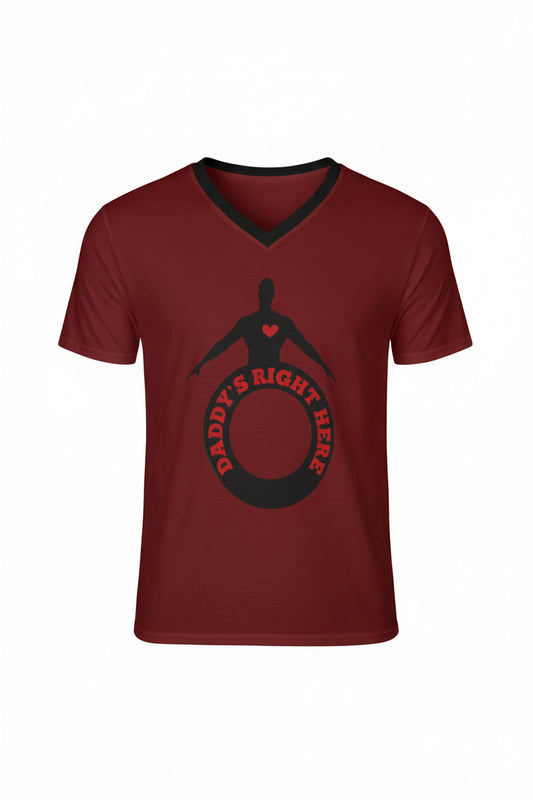 A man wearing a maroon red V-neck t-shirt with a black graphic on the chest that reads 'DADDY'S RIGHT HERE' with a silhouette of a person inside a circle.