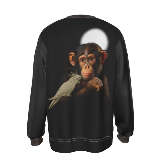 A black crewneck sweatshirt shown from the back, featuring a large graphic print of a chimpanzee holding a white cockatoo, with a white circular spotlight graphic behind the animal.