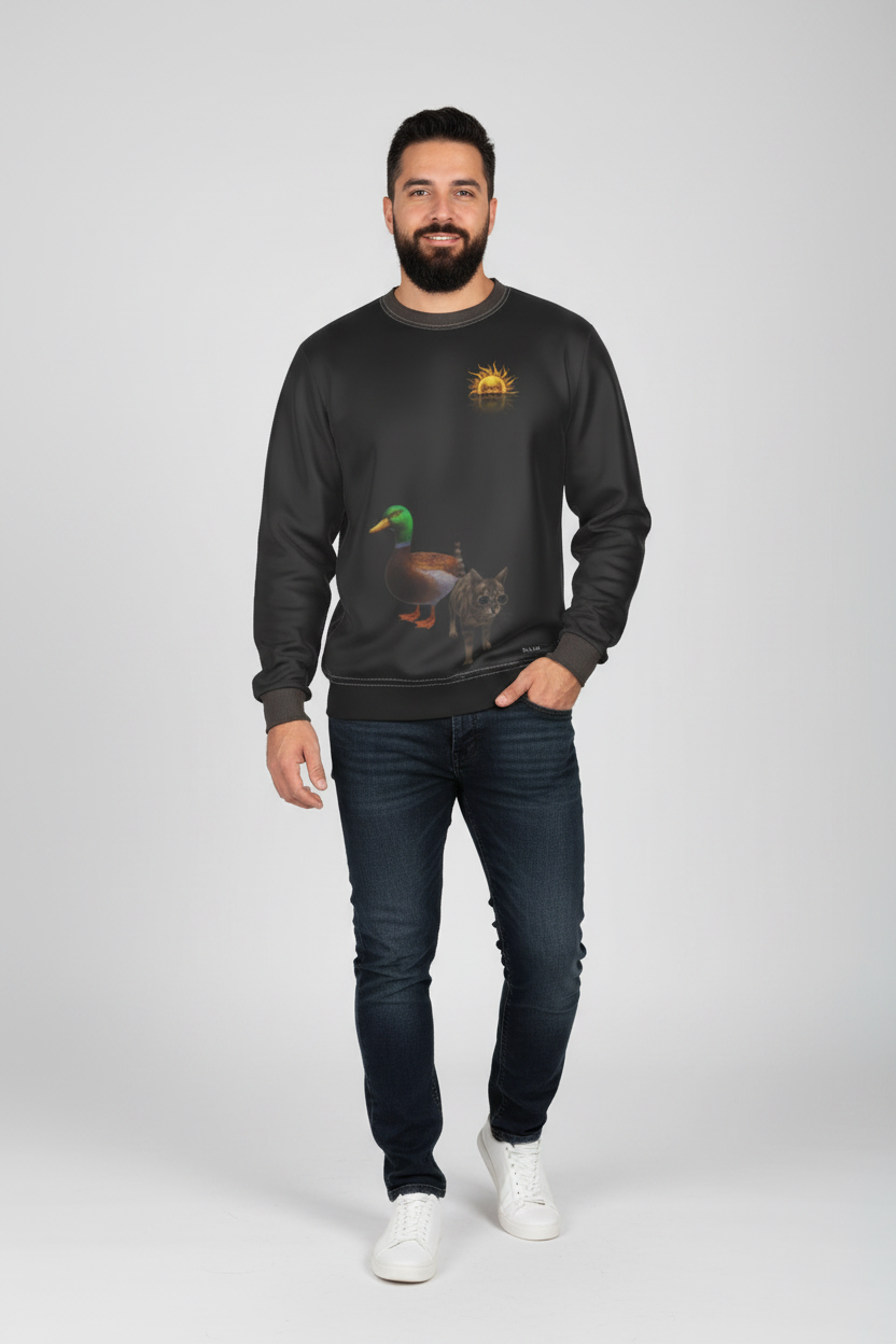 A man modeling a dark gray crewneck sweatshirt with a graphic of a mallard duck and a small sun logo on the chest, paired with dark blue jeans and white sneakers against a light gray background.